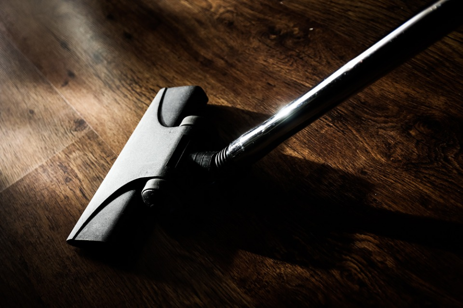 a vacuum cleaner on a wooden floor